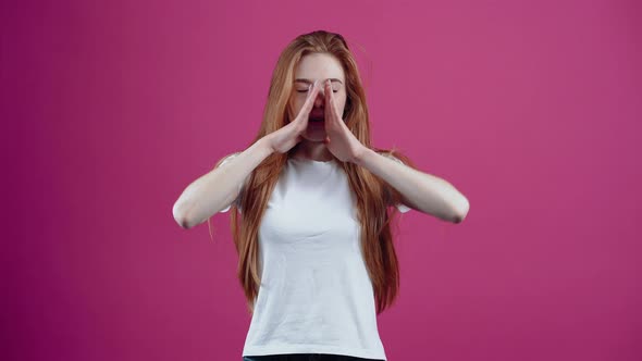 The Charismatic Redhead Puts Her Hands to Her Mouth and Starts Screaming in the Distance alt