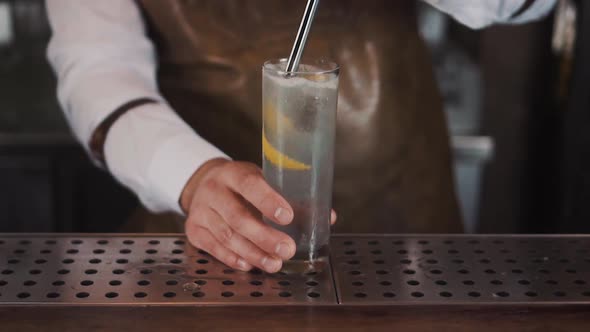 The Bartender Makes a Cocktail