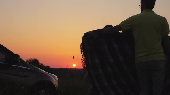 Happy Family Hugging Watching the Sunset