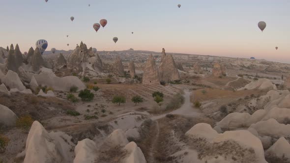 Cappadocia Aerial Shot of Rock Chimneys and Uchisar Castle in Goreme Turkey alt