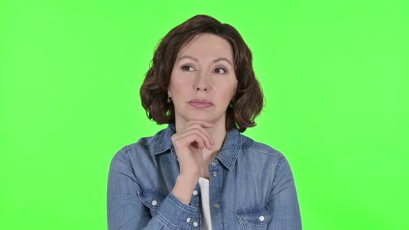Old Woman Thinking of New Idea on Green Chroma Key Background  alt