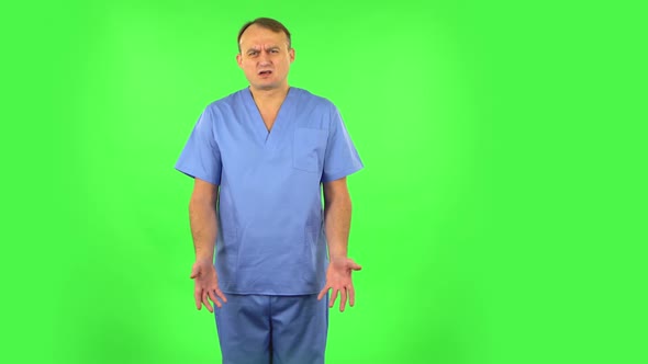 Medical Man Says Wow in Disgust, Negatively Waving His Head. Green Screen alt