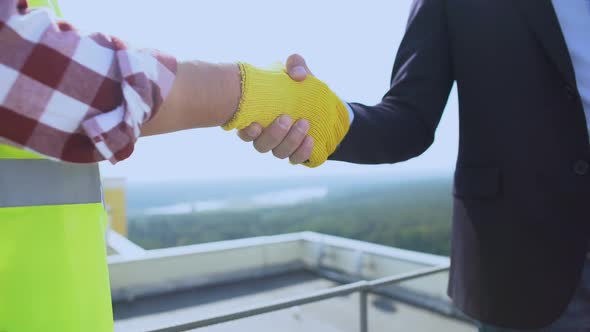 Construction Foreman and Contractor Shaking Hands, Business Deal, Partnership