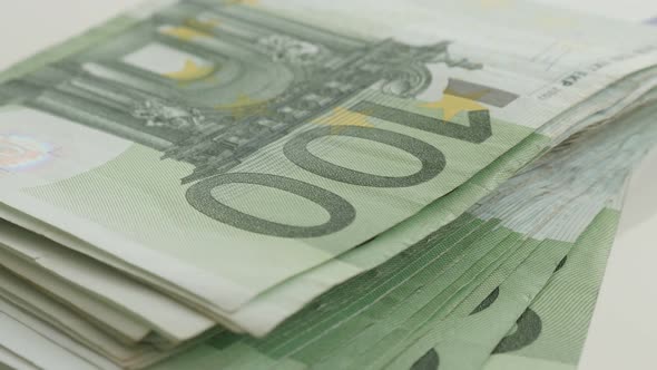 Slow tilt Euro paper money on stack 4K 2160p 30fps UltraHD footage - Wad of European Union currency  alt