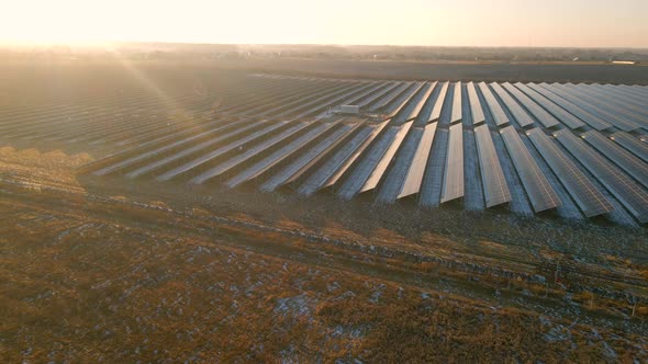 Close Up Drone View of Solar Panels Stand in a Row in the Fields Power Ecology Innovation Nature alt