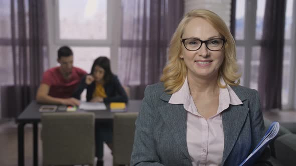 Portrait of Senior Adult Real-estate Agent Smiling alt