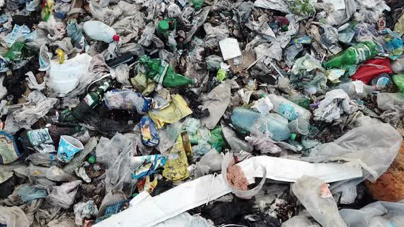 Garbage in the canals after the flood. Contaminated rivers with plastic waste. alt