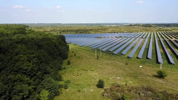 Solar Batteries In The Field. Solar power station energy from natural in the countryside alt