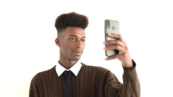 Close Up Portrait of Young Man Taking a Selfie on His Phone