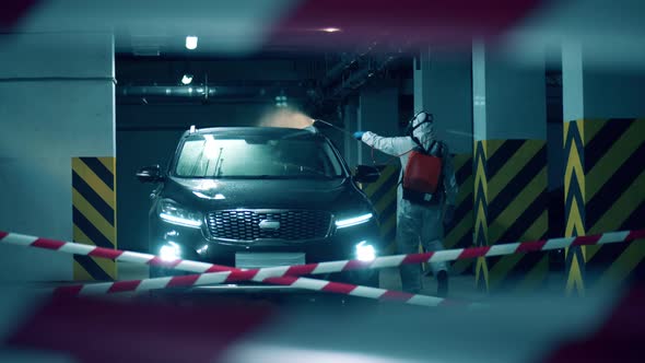 A Car Is Getting Chemically Sanitized By an Expert in the Garage alt