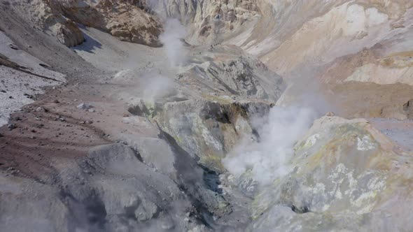 Aerial Drone Footage of Mutnovsky Volcano Crater with Fumaroles and Glacier