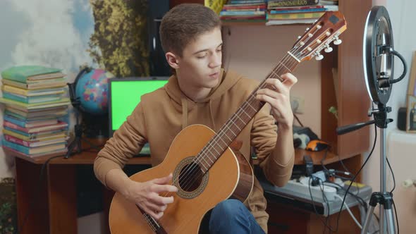 Guy Playing Guitar alt