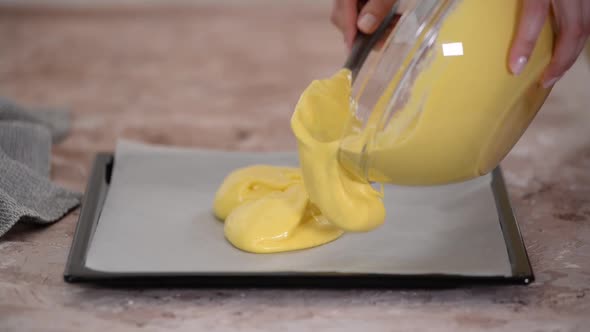 Closeup View of Cake Dough Pouring to a Baking Tray