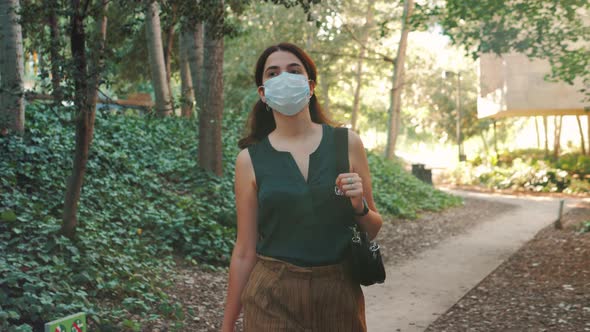 Safety Woman Going to the Office During COVID19 Pandemic Business People with Face Mask Latina Girl alt
