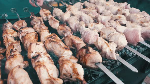 Shish Kebab is Grilled on Skewers on the Open Barbecue at the Food Court alt