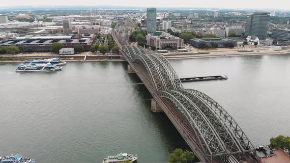 4k aerial drone footage circling the Hohenzollern Bridge in Cologne, Germany. alt