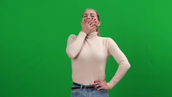 Exhausted Young Woman Yawning at Chromakey Background alt