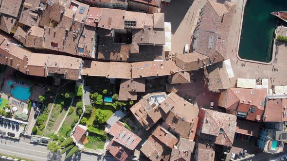 Aerial Shot. Top View of the Beautiful Italian City of Riva Del Garda. Old Low Houses, Narrow alt
