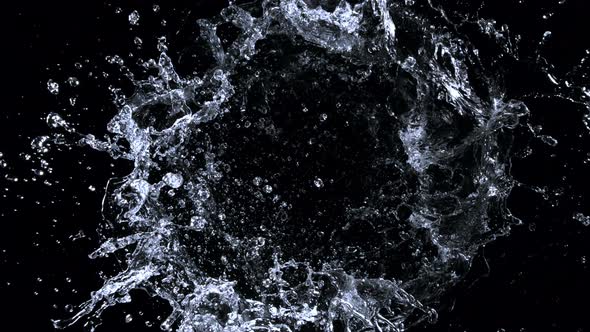 Super Slow Motion Shot of Rotating Water Ring Moving Towards Camera at 1000Fps alt