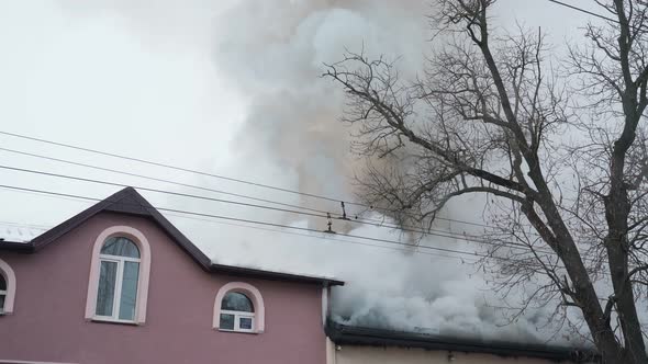 Burning Roof with Heavy Smoke in Residential House alt