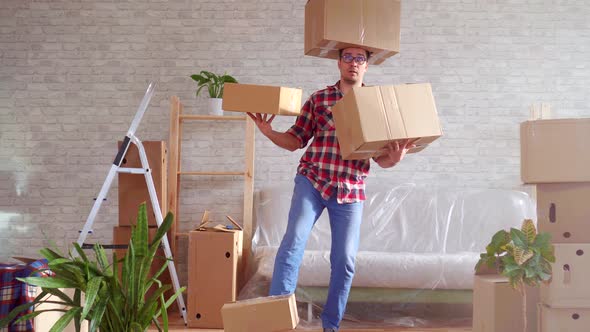 Man in Glasses and Shirt with Boxes on His Head Hands and Feet alt