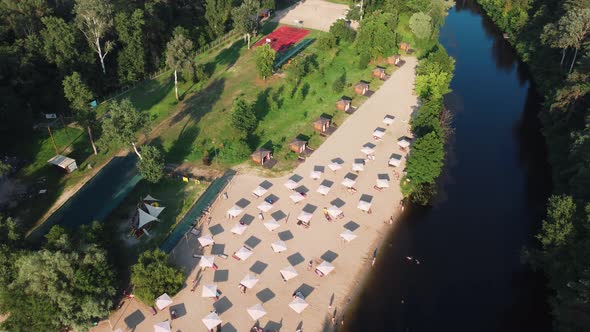 Aerial Top View of River Sand Beach with Lounges and Umbrellas alt