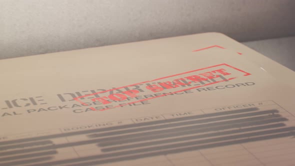 Steel safe with top secret file folder. Restricted, classified documents. 4KHD alt