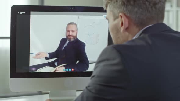 Coworkers Speaking via Video Call alt