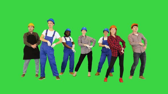 Happy Team Of Construction Workers Dancing Disco on a Green Screen Chroma Key alt
