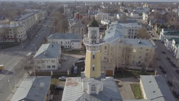 Aerial view of Fire Tower Kostroma city, Russia. Cityscape, orthodox temple, cars on street road