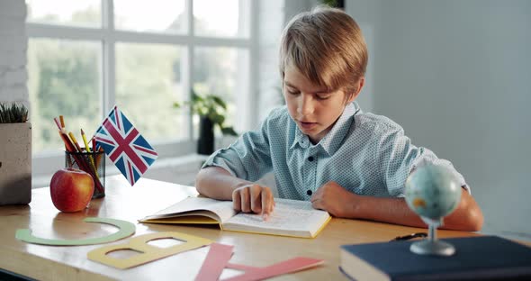 Boy Studying English in Classroom