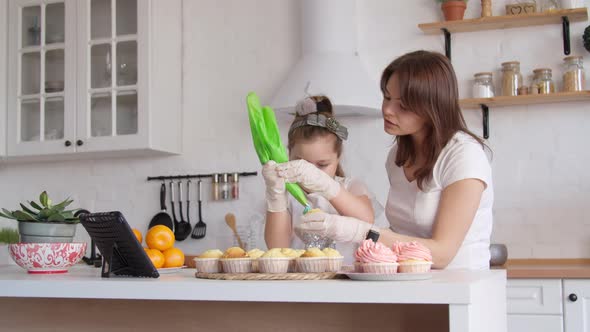 Mother and Daughter Icing Cupcakes