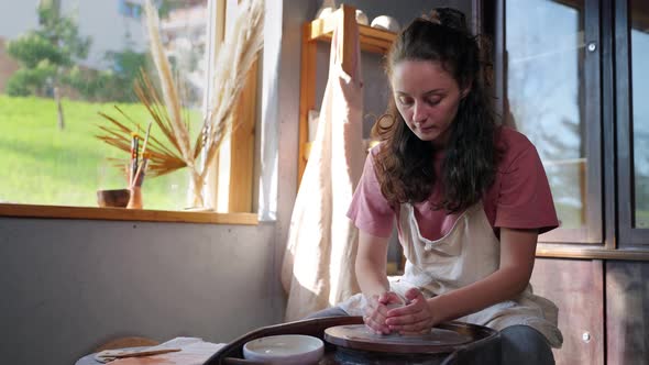 Woman Potter Starts Creating Her Ceramic Dish alt