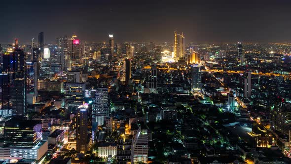 Bangkok business district city center, rush hour traffic, at night, zoom in – Time Lapse