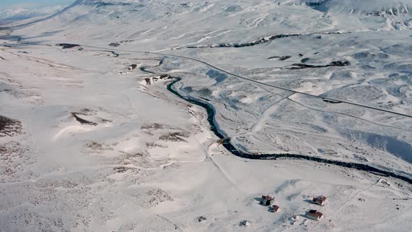 Aerial View of a Winding Road Among the Snowy Mountains in the North of Iceland