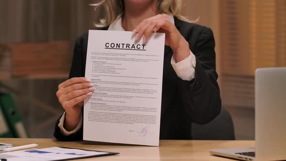 Businesswoman Ripping Contract Into Small Apart and Throws Into Air alt