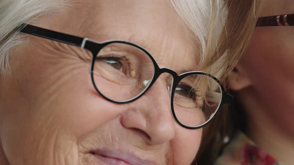 Close Up Shot of Smiling Senior and Young Woman with Glasses. Family Love alt