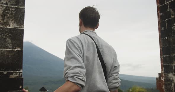 Close Up View Circling a Man Standing Between the Gates of Heaven Tourist Attraction in Pura alt