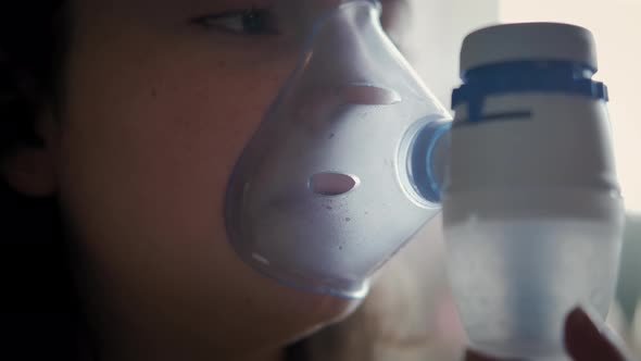 Close Up Footage of Childhood Asthma Inhaling Mask Illnesses Little Girl Doing Aerosol Independently alt