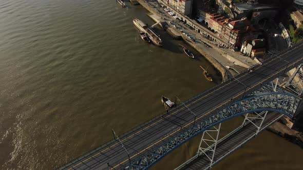 Old Metal Bridge with Distant Pedestrians Against River alt