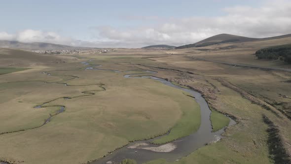 Aerial view of Paravani river floating in Saghamo Lake. Samtskhe-Javakheti, Georgia alt
