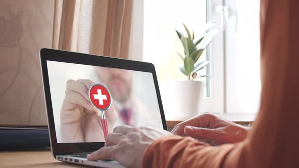 Doctor's Call on Laptop and Stethoscope Bell with the Swiss Flag alt