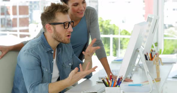 Young Woman Talking to her Coworker alt