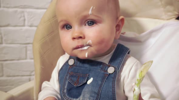 Baby Got Dirty with Food Licks Spoon Closeup