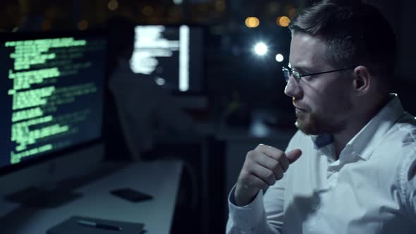 IT Specialist Working in Night Office alt