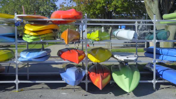 Panning Shot of Colorful Kayaks on Rack at Beach in Port Washington Long Island alt