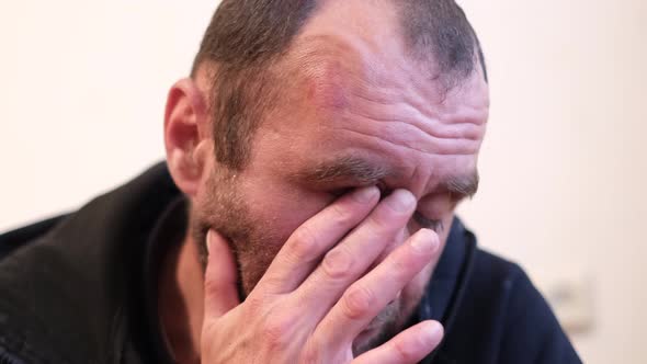 Tired Man Rubs His Eyes He is Tired and Wants to Sleep alt