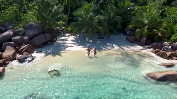 Praslin Seychelles Tropical Island with Withe Beaches and Palm Trees Couple Men and Women Mid Age on alt
