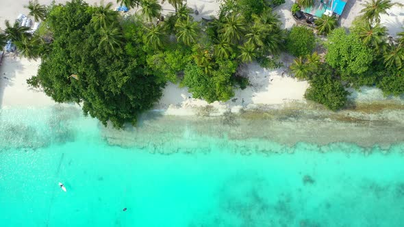 Luxury overhead abstract view of a white sandy paradise beach and aqua blue water background alt