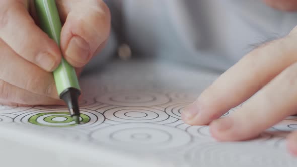 Man with Down Syndrome Drawing on Coloring Page alt